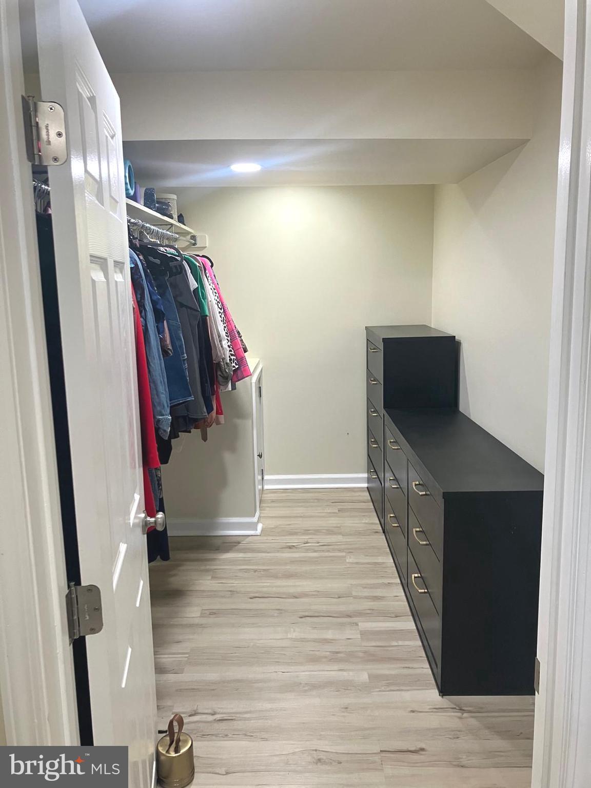 626 South Irving Street Arlington, VA 22204 - Photo 18 of 28 a view of walk in closet with clothes and shoes