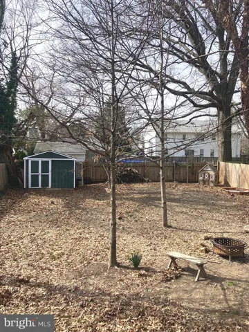 a view of a yard covered in snow