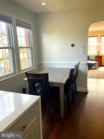 a view of a dining room with furniture and window