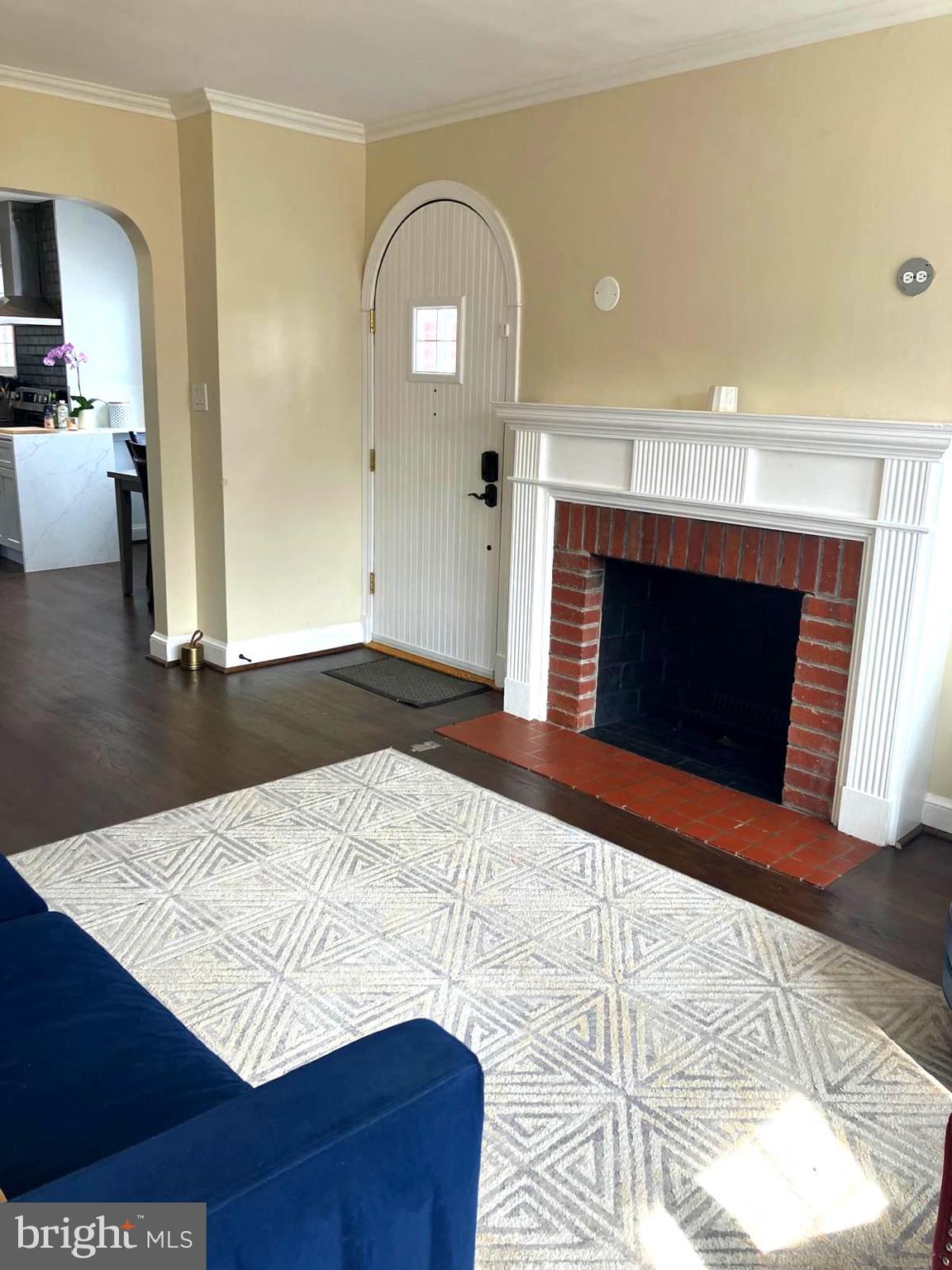 626 South Irving Street Arlington, VA 22204 - Photo 8 of 28 a view of empty room with wooden floor and fireplace