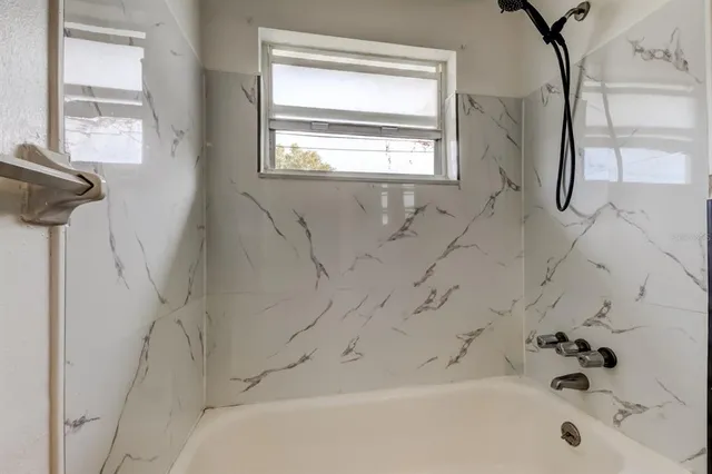 a bathroom with a bathtub