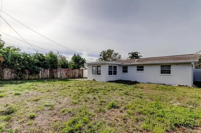 a house with a tree in front of it