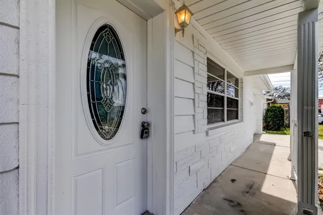 a view of a entryway door with wooden floor