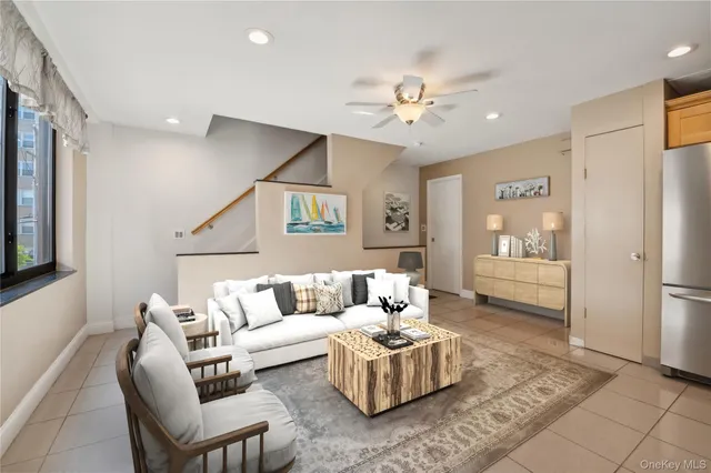 a living room with furniture and a table