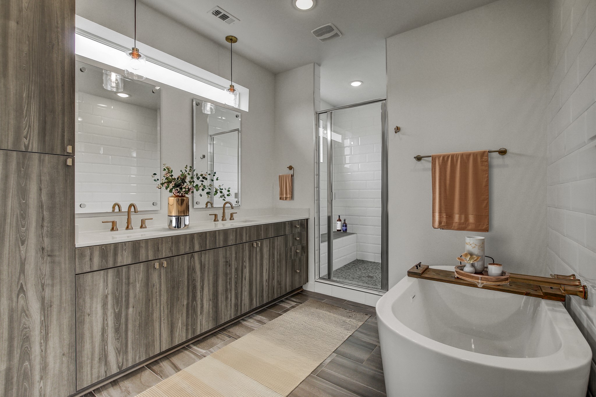 2624 Metcalfe Road, Unit 17 Austin, TX 78741 - Photo 21 of 35 a bathroom with a double vanity sink and a mirror