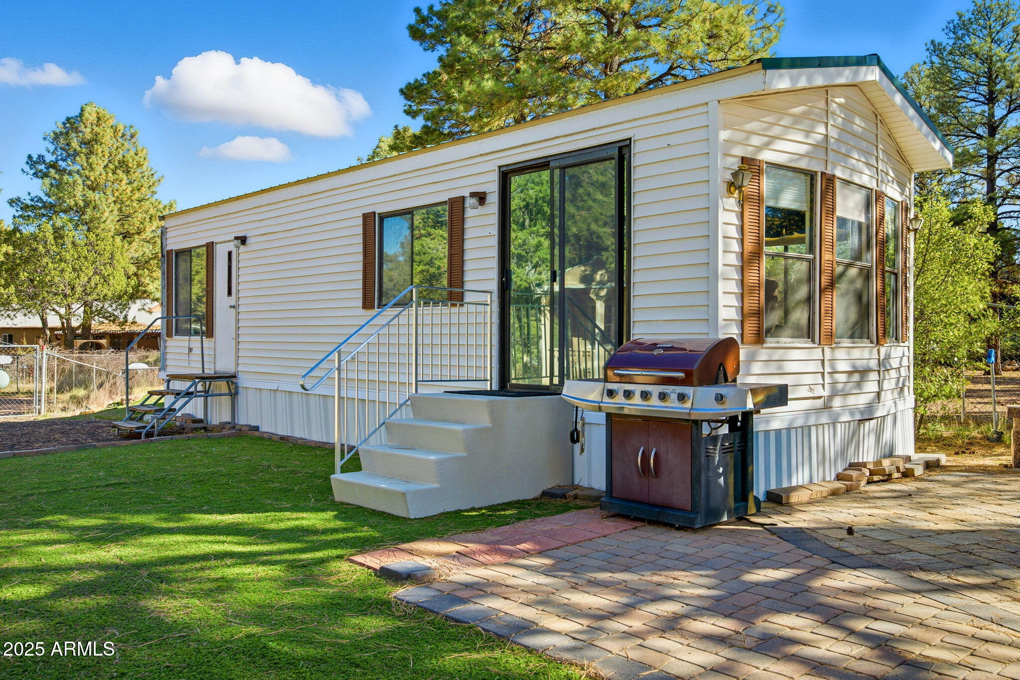 2169 Tenderfoot Trail Overgaard, AZ 85933 - Photo 1 of 30 a view of a house with yard and sitting area