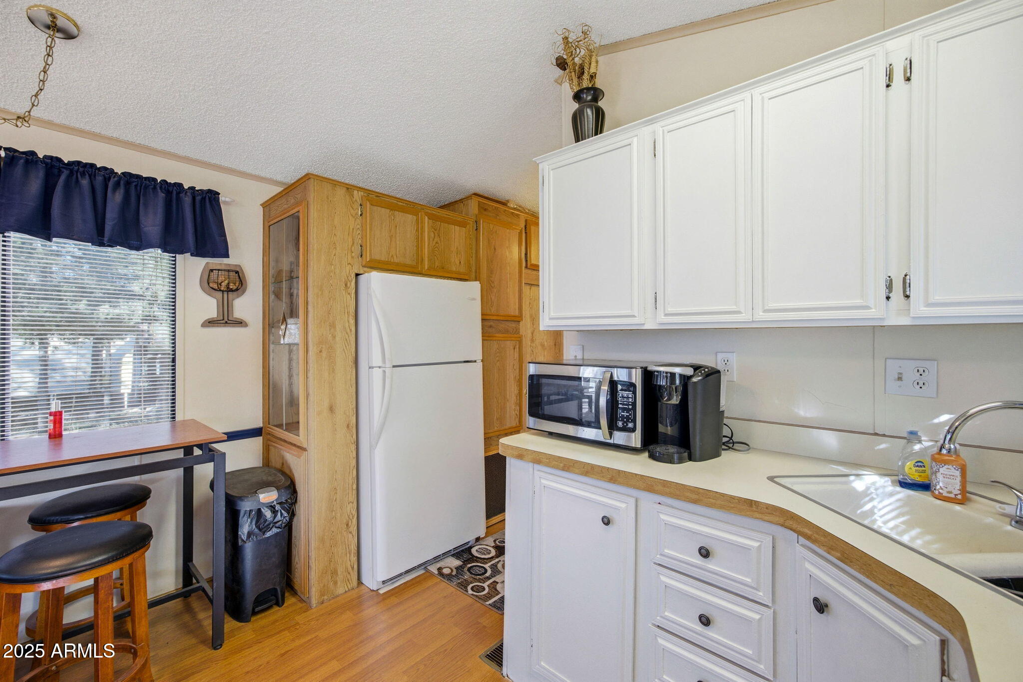 2169 Tenderfoot Trail Overgaard, AZ 85933 - Photo 12 of 30 a kitchen with refrigerator and cabinets