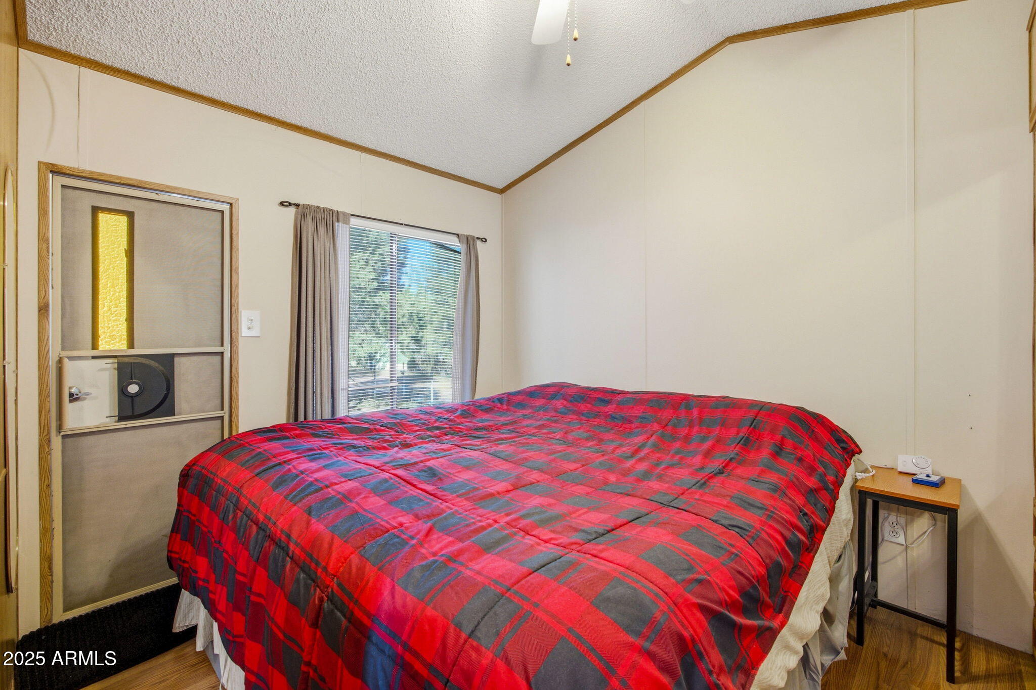 2169 Tenderfoot Trail Overgaard, AZ 85933 - Photo 13 of 30 a bedroom with a bed and window