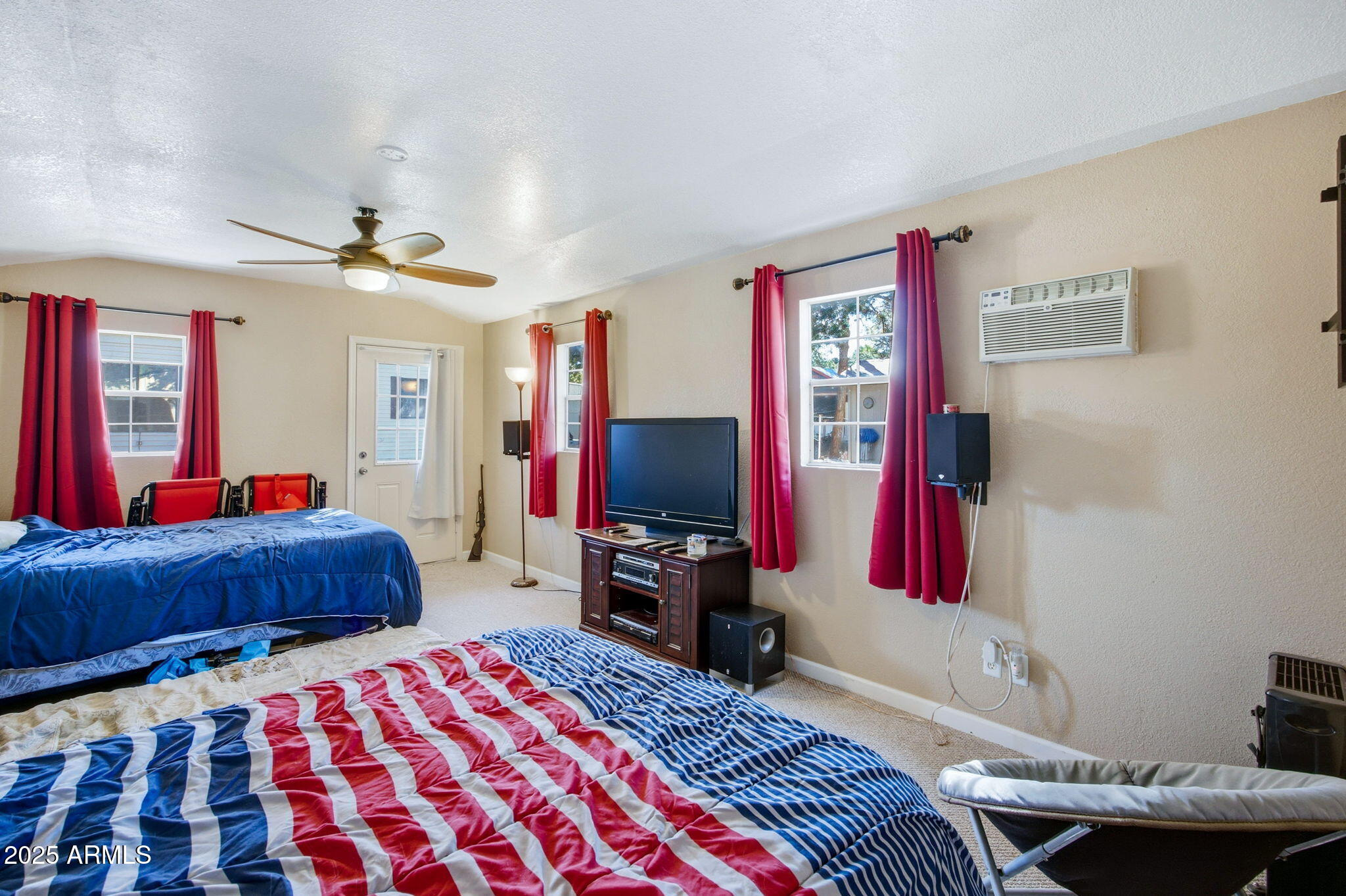 2169 Tenderfoot Trail Overgaard, AZ 85933 - Photo 25 of 30 a bed room with a bed and a television