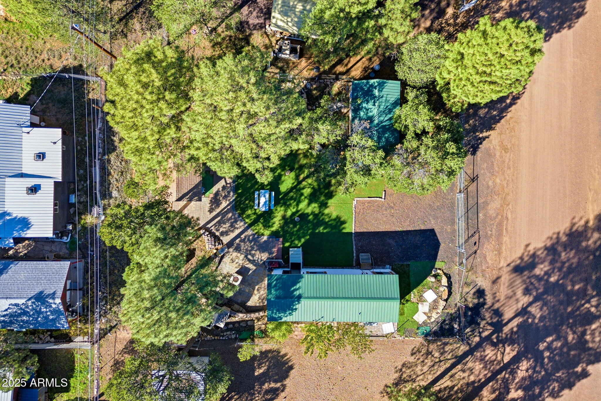 2169 Tenderfoot Trail Overgaard, AZ 85933 - Photo 27 of 30 a view of house with flower garden