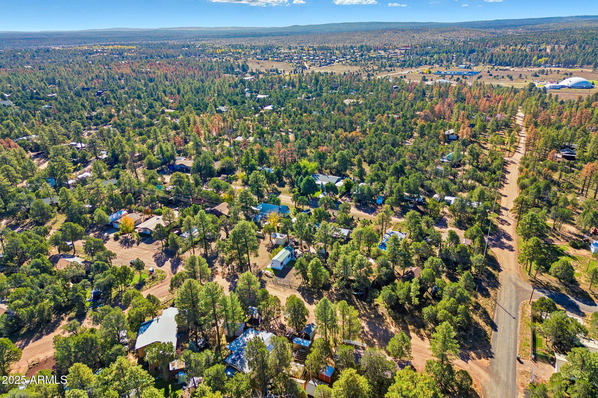 2169 Tenderfoot Trail Overgaard, AZ 85933 - Photo 28 of 30 a view of a city with lush green forest