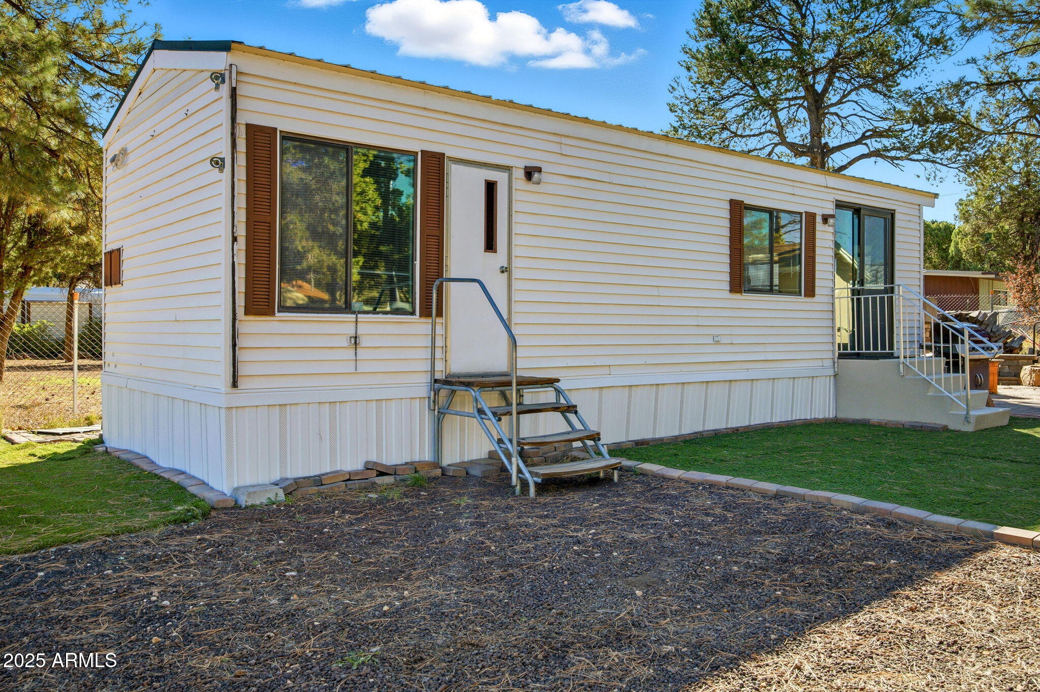 2169 Tenderfoot Trail Overgaard, AZ 85933 - Photo 4 of 30 a view of a house with backyard and sitting area