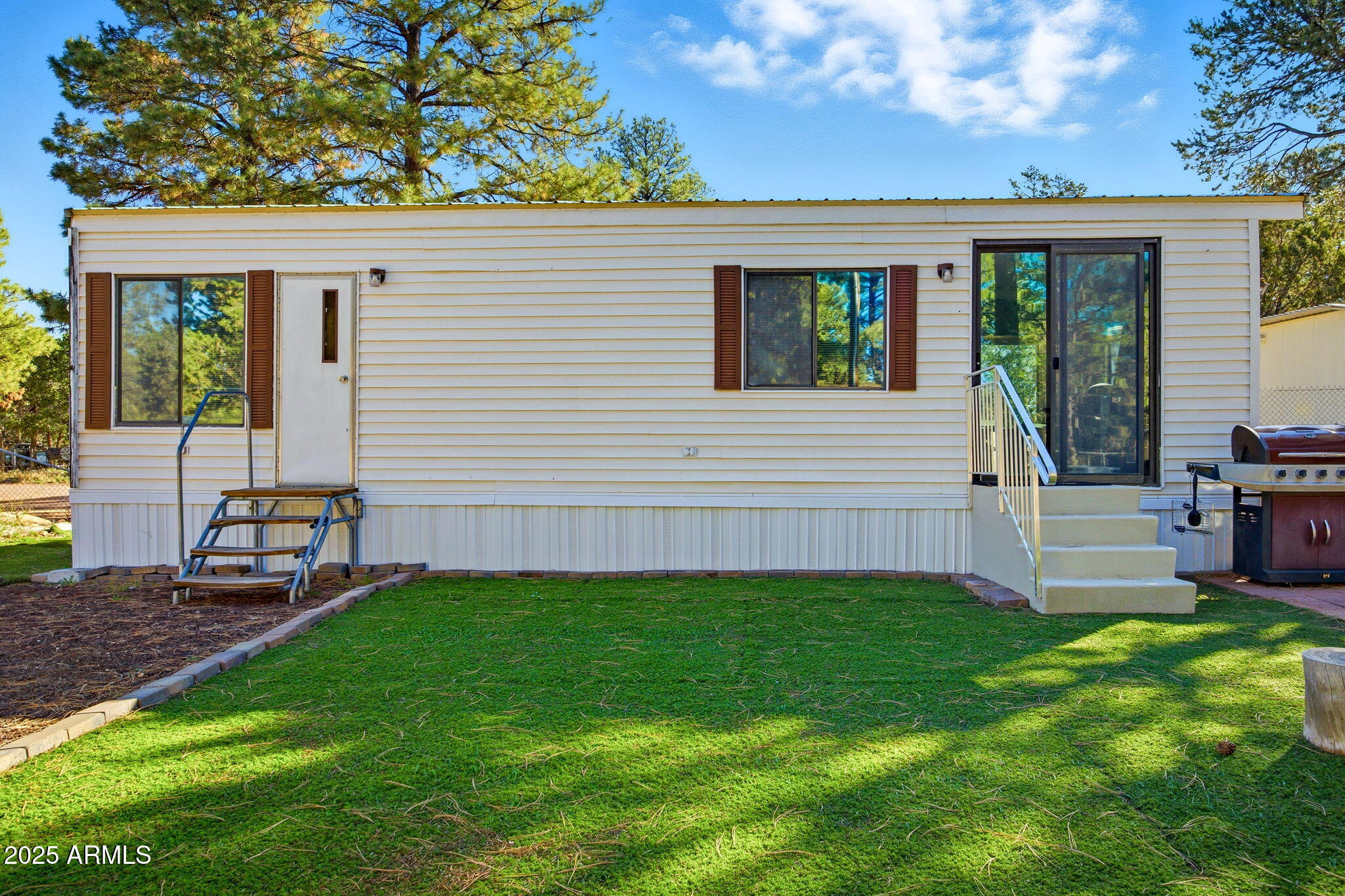 2169 Tenderfoot Trail Overgaard, AZ 85933 - Photo 5 of 30 a view of backyard with a garden and deck