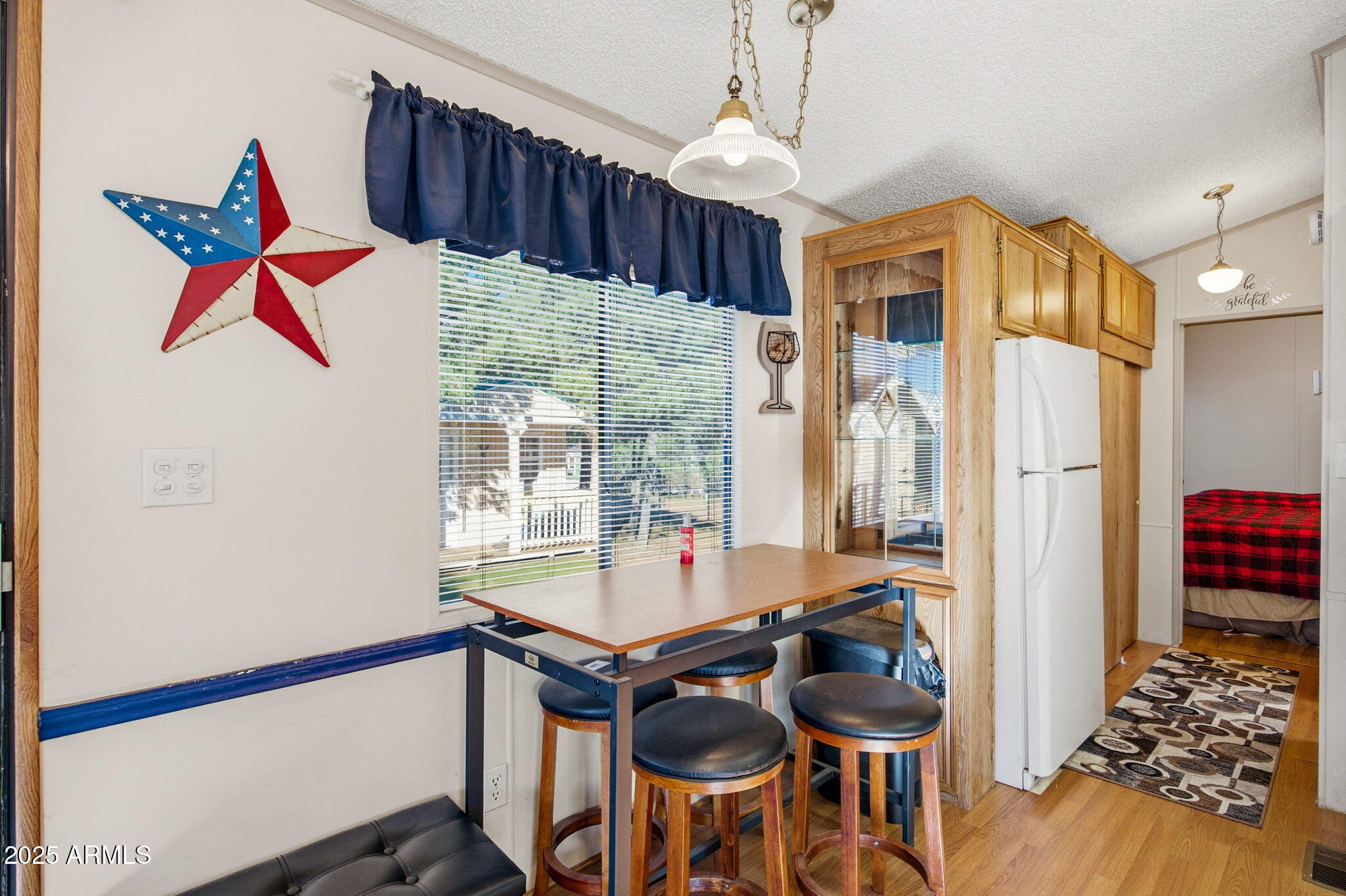 2169 Tenderfoot Trail Overgaard, AZ 85933 - Photo 9 of 30 a very nice looking room with many windows and furniture