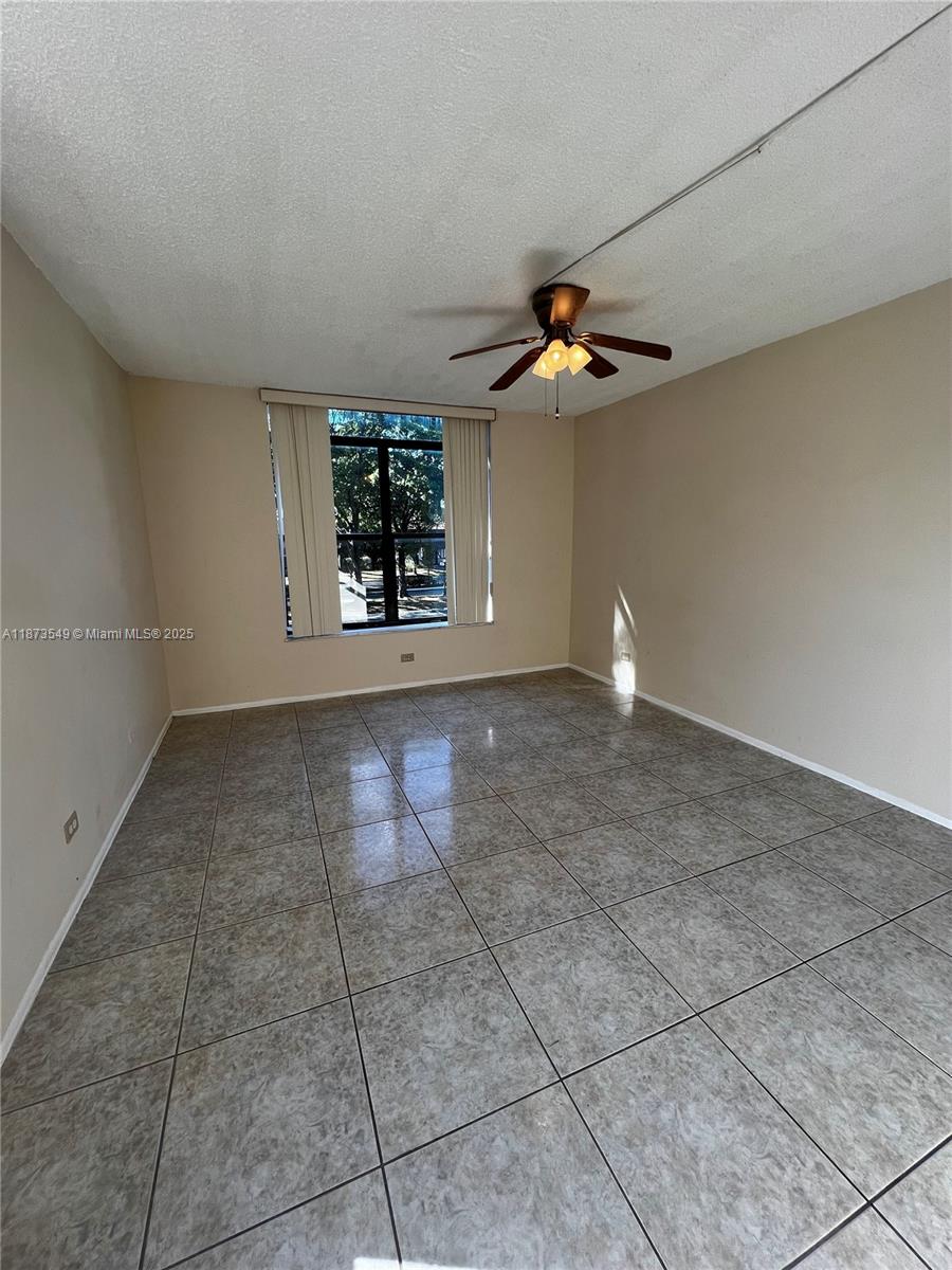 3760 Inverrary Drive, Unit 2Z Lauderhill, FL 33319 - Photo 14 of 34 a view of room with a ceiling fan and window