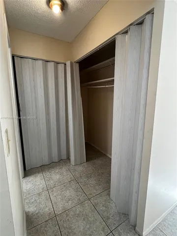 a bathroom with a glass door