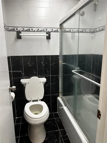a bathroom with a toilet and a sink