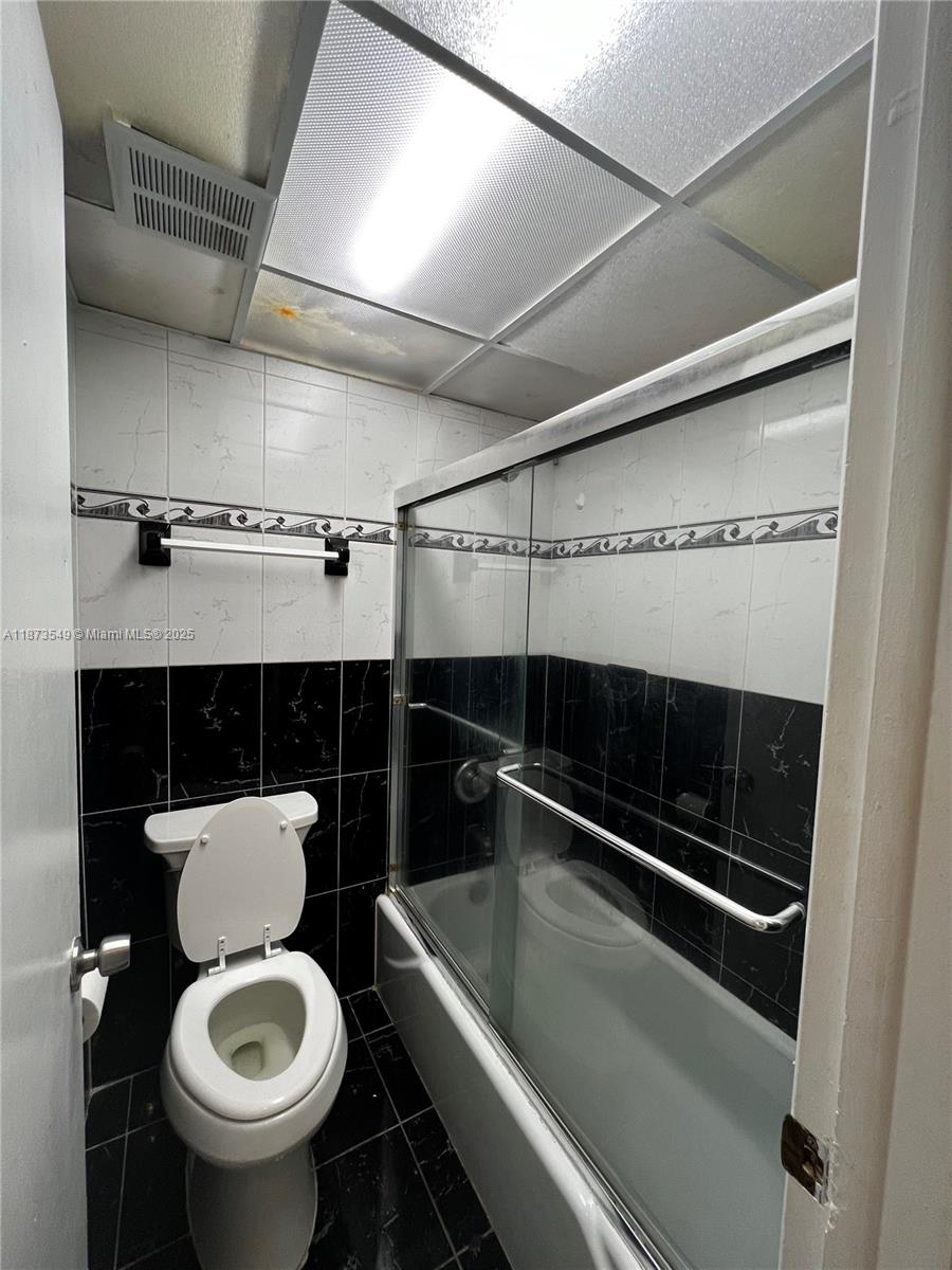 3760 Inverrary Drive, Unit 2Z Lauderhill, FL 33319 - Photo 20 of 34 a bathroom with a toilet and a sink