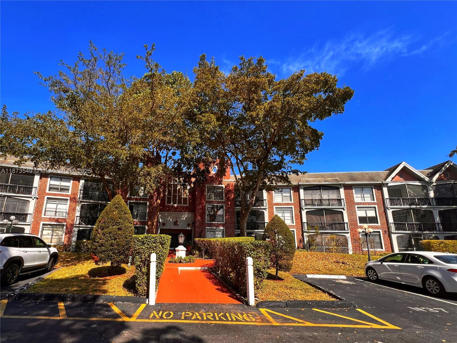 3760 Inverrary Drive, Unit 2Z Lauderhill, FL 33319 - Photo 2 of 34 a view of a city that has lots of cars parked on the road