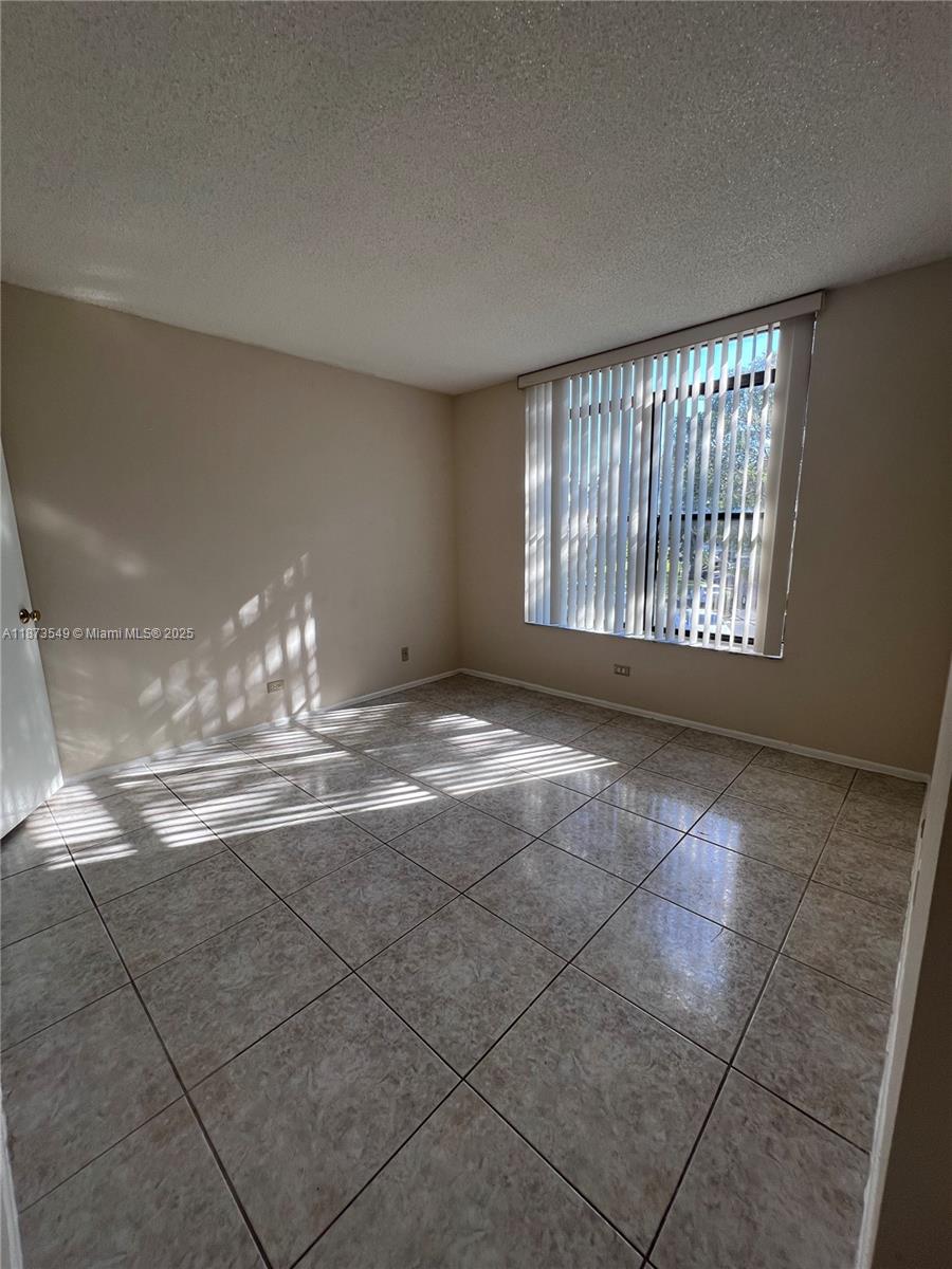 3760 Inverrary Drive, Unit 2Z Lauderhill, FL 33319 - Photo 23 of 34 a view of an empty room with a window