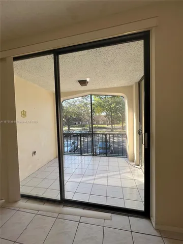 a view of a glass door with a porch
