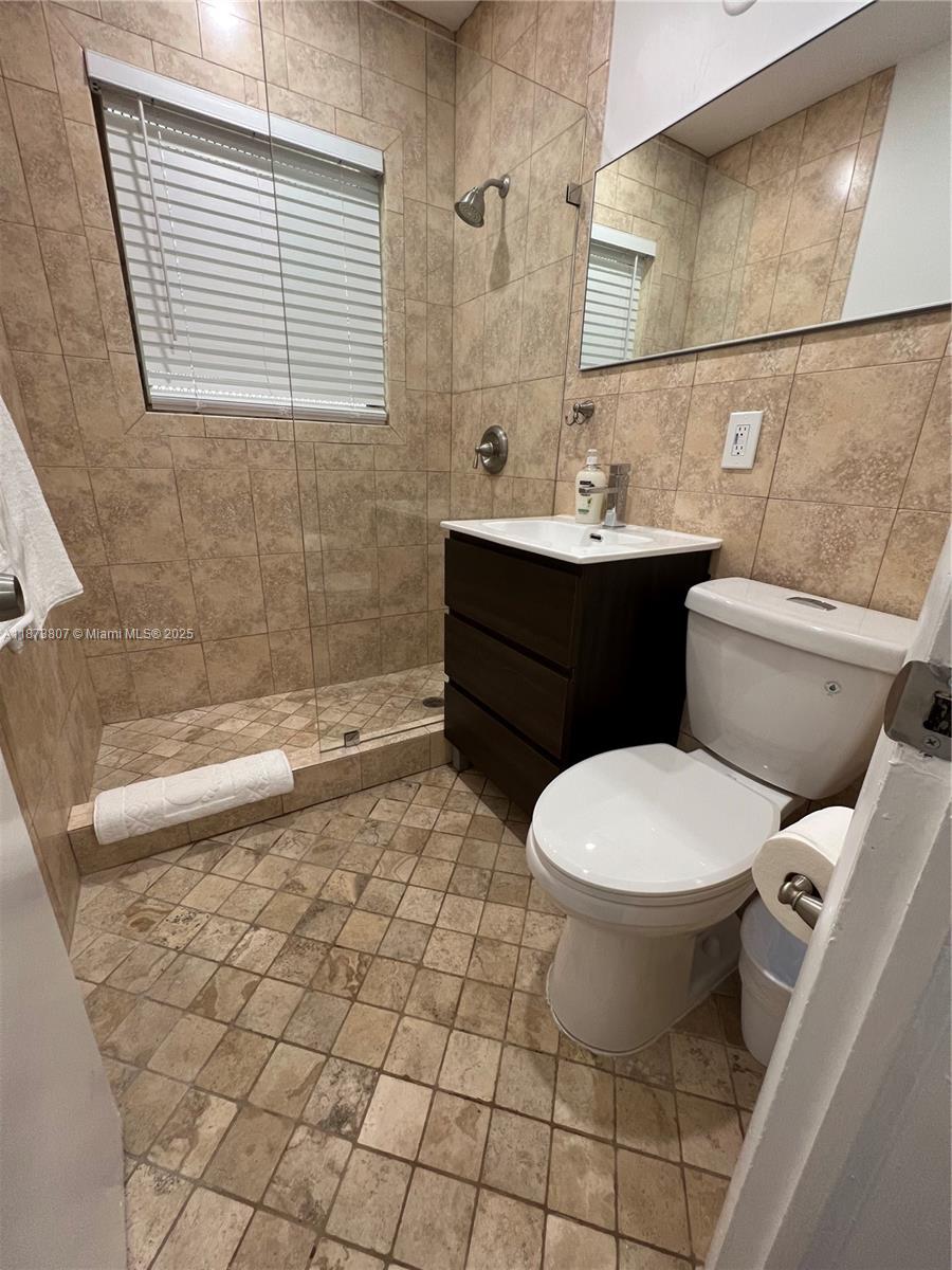 620 Jefferson Avenue, Unit 2 Miami Beach, FL 33139 - Photo 14 of 24 a bathroom with a sink toilet and shower
