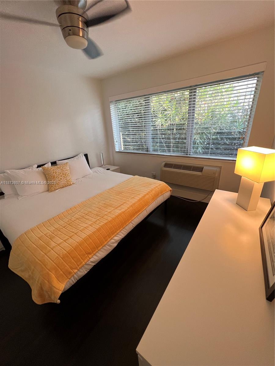 620 Jefferson Avenue, Unit 2 Miami Beach, FL 33139 - Photo 22 of 24 a bed sitting in a bedroom next to a window