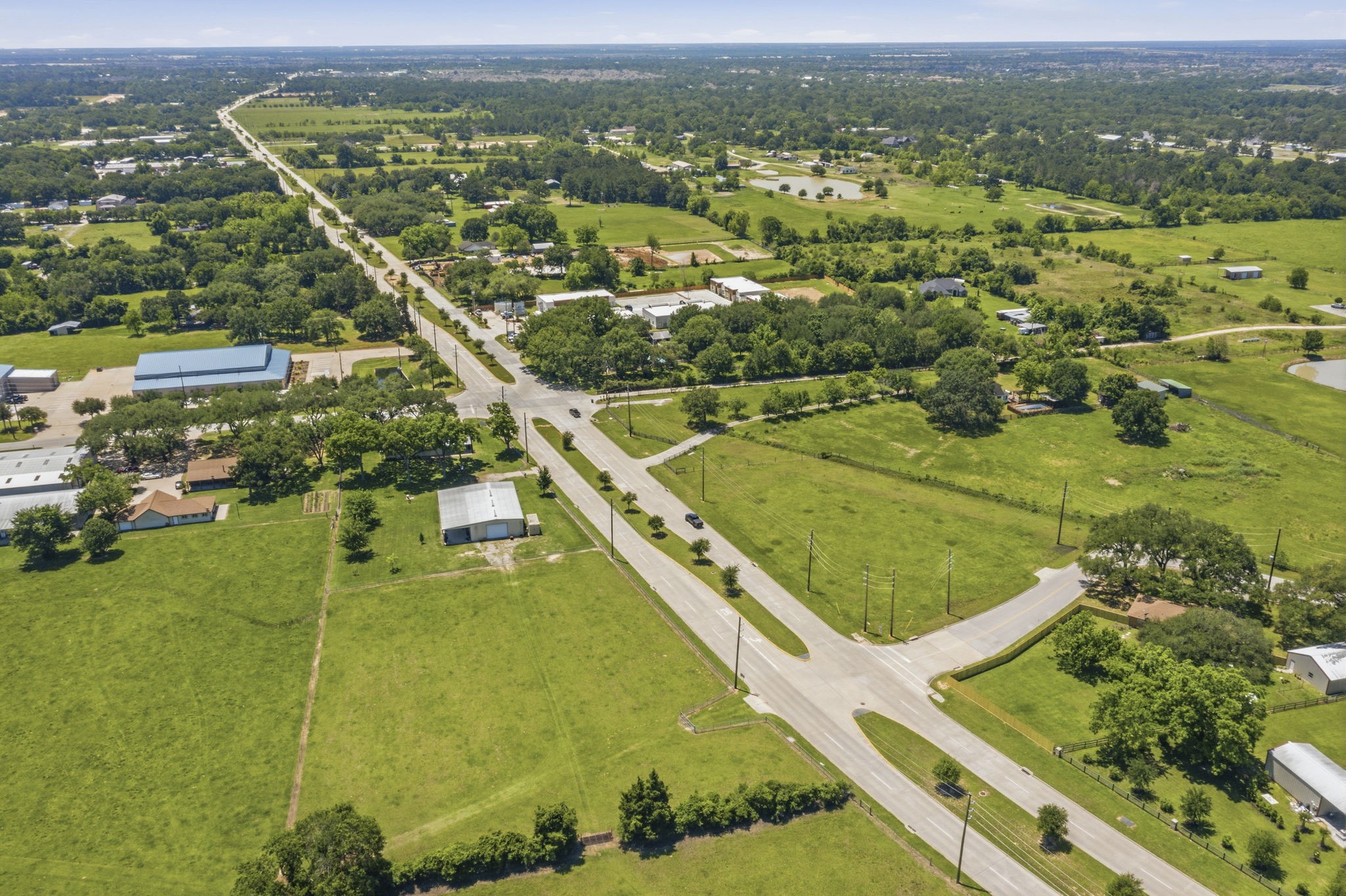 0 Mueschke Road Tomball, TX 77377 - Photo 43 of 44 an aerial view of a residential houses with outdoor space and a lake view