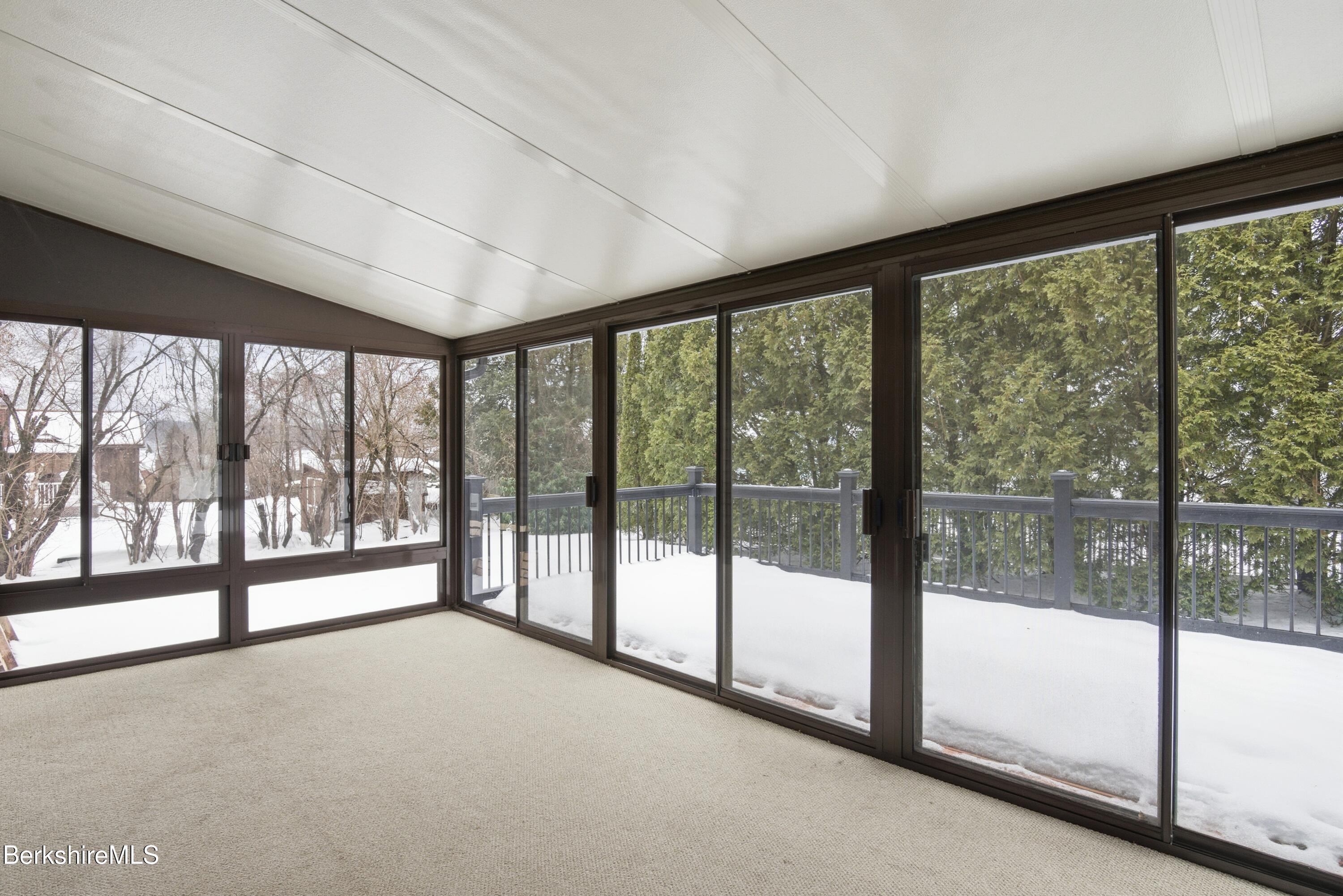 11 Opeechee Street Lanesborough, MA 01237 - Photo 12 of 35 a view of an empty room with large windows