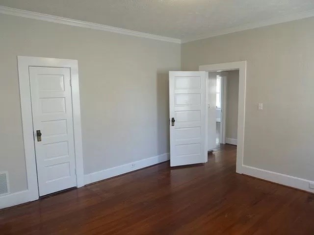 1344 Rhodes Street Columbus, GA 31901 - Photo 5 of 10 an empty room with wooden floor & closet area