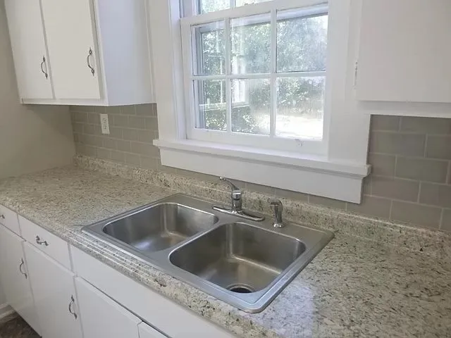 a view white sink and cabinets