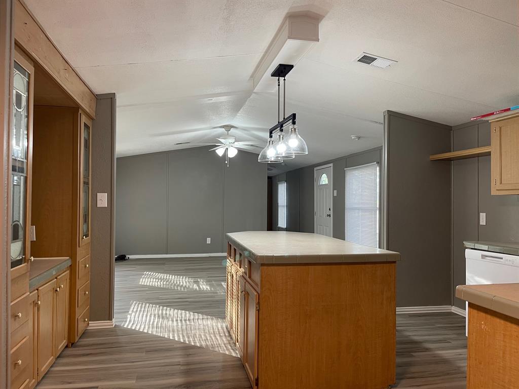 a view of a kitchen from the hallway