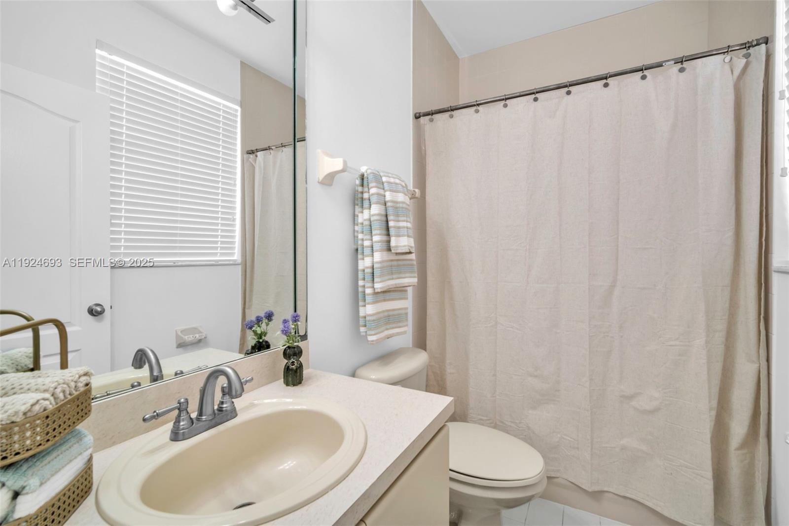 13030 Northwest 8th Street Miami, FL 33182 - Photo 12 of 54 a bathroom with a sink toilet and shower