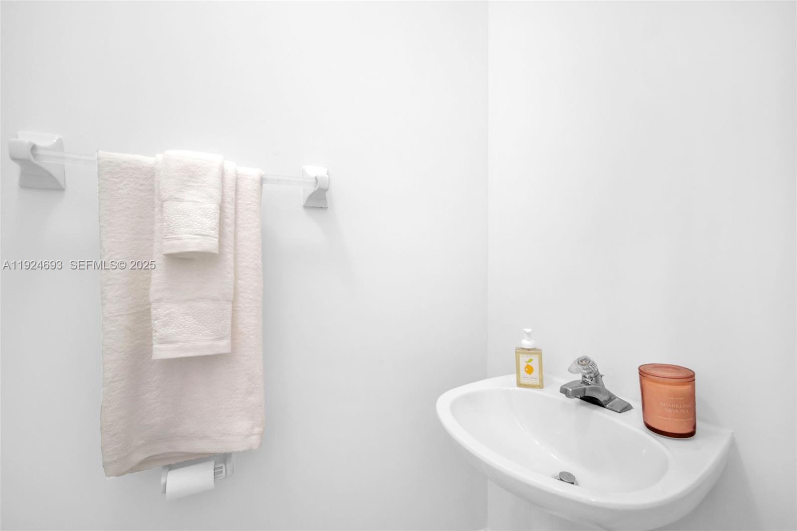 13030 Northwest 8th Street Miami, FL 33182 - Photo 14 of 54 a bathroom with a sink and a mirror