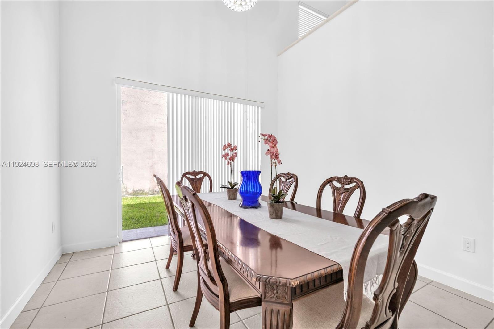 13030 Northwest 8th Street Miami, FL 33182 - Photo 18 of 54 a view of a dining room with furniture window and outside view