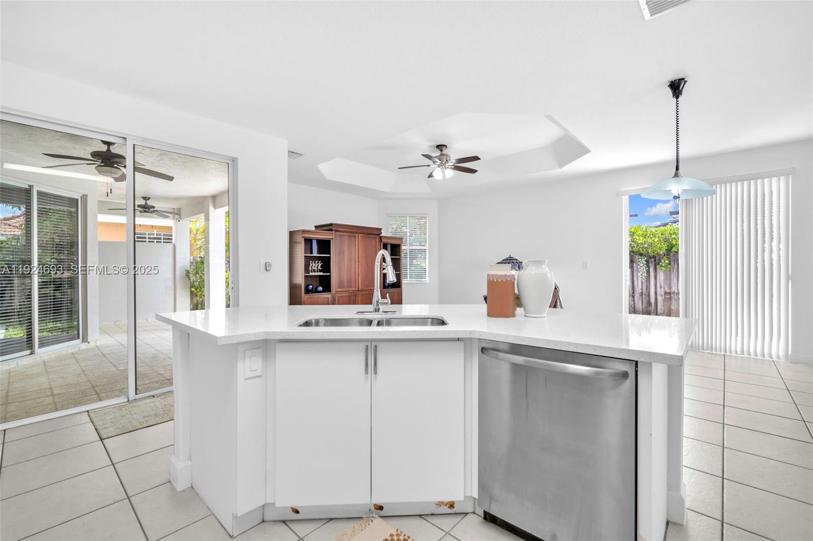 13030 Northwest 8th Street Miami, FL 33182 - Photo 31 of 54 a kitchen with a sink and cabinets