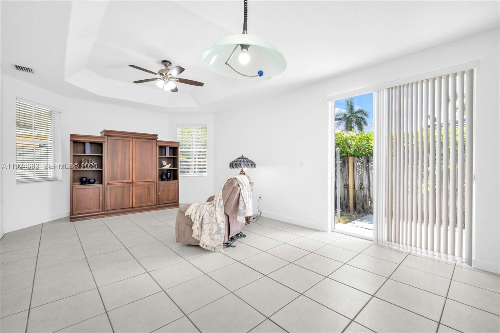 13030 Northwest 8th Street Miami, FL 33182 - Photo 32 of 54 a view of a livingroom with furniture and chandelier