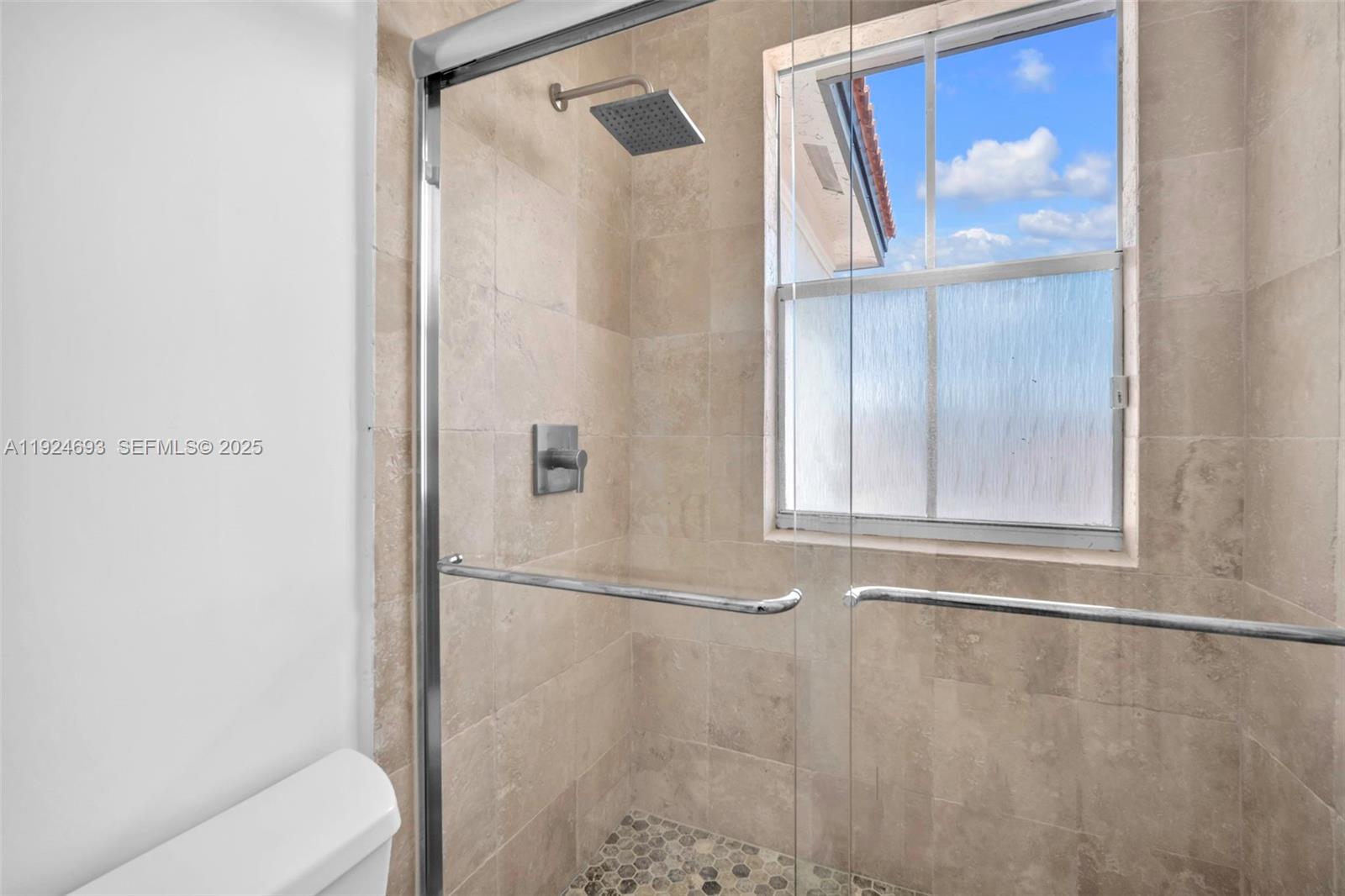 13030 Northwest 8th Street Miami, FL 33182 - Photo 39 of 54 a bathroom with a bathtub and a shower