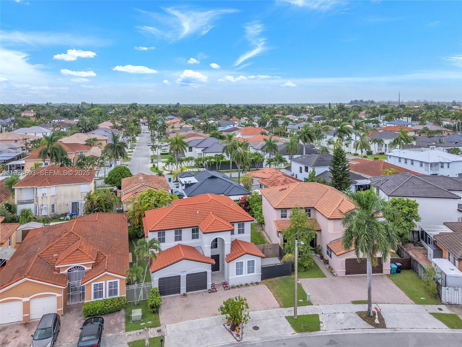 13030 Northwest 8th Street Miami, FL 33182 - Photo 44 of 54 an aerial view of residential houses with outdoor space