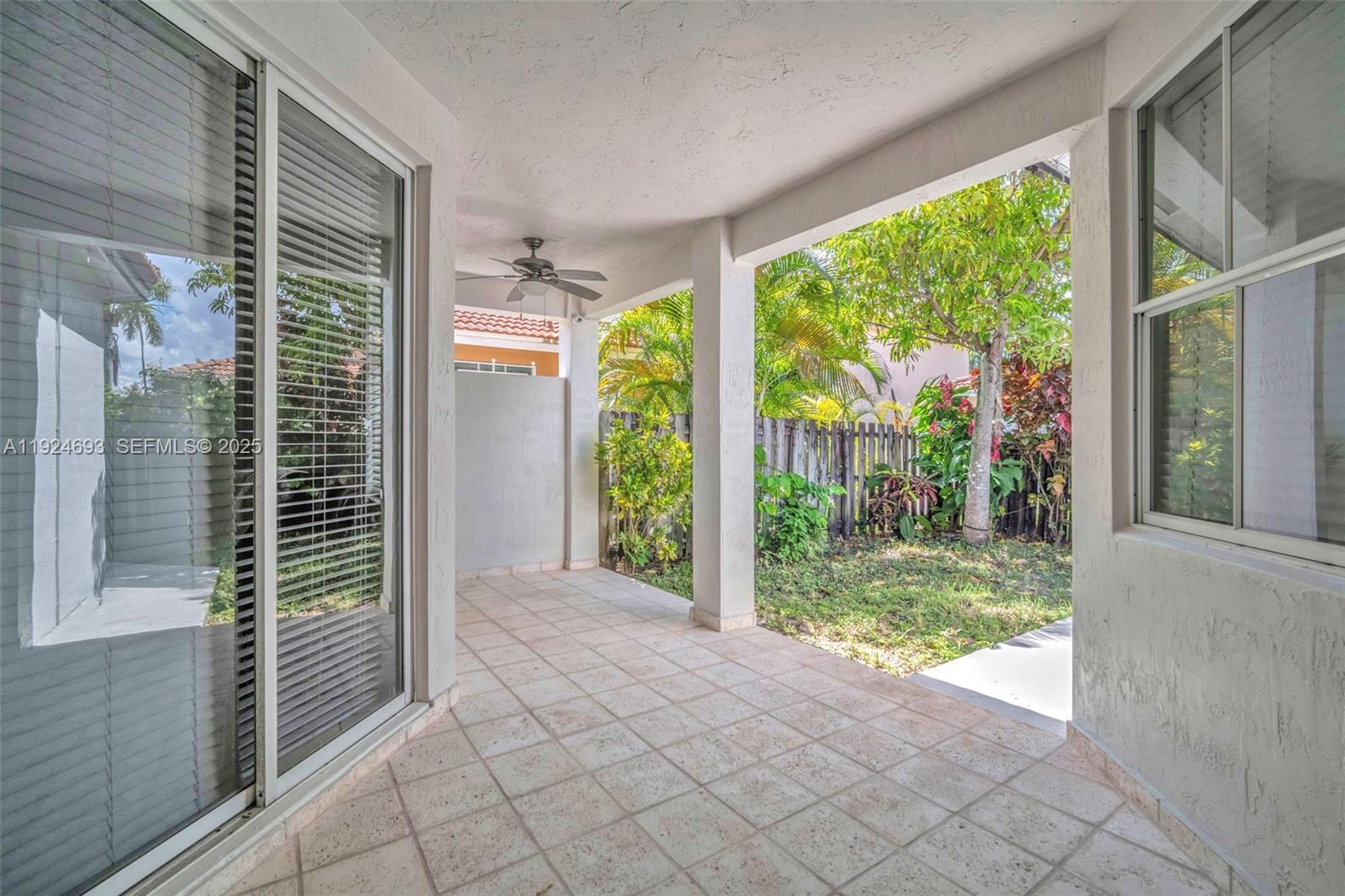 13030 Northwest 8th Street Miami, FL 33182 - Photo 5 of 54 a view of a porch with a large windows