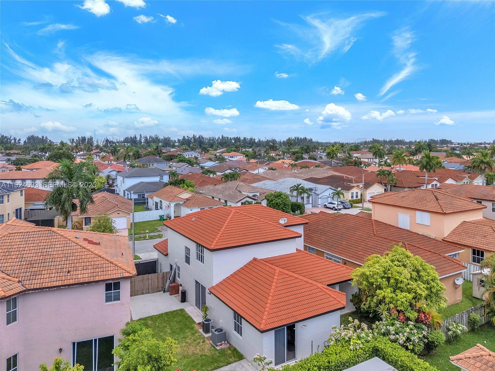 13030 Northwest 8th Street Miami, FL 33182 - Photo 54 of 54 an aerial view of residential houses with outdoor space and ocean view