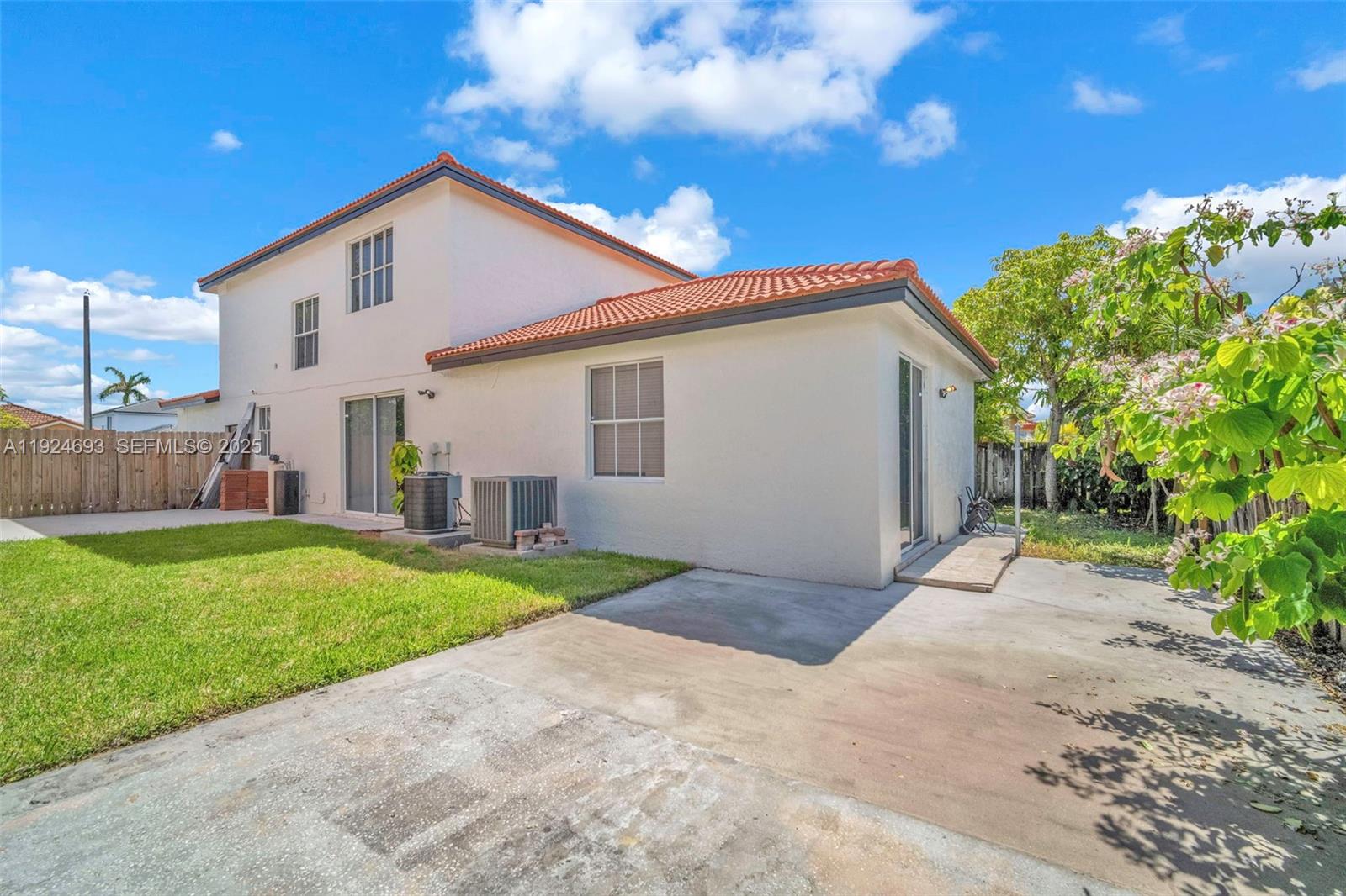 13030 Northwest 8th Street Miami, FL 33182 - Photo 6 of 54 a view of a house with yard and a garden