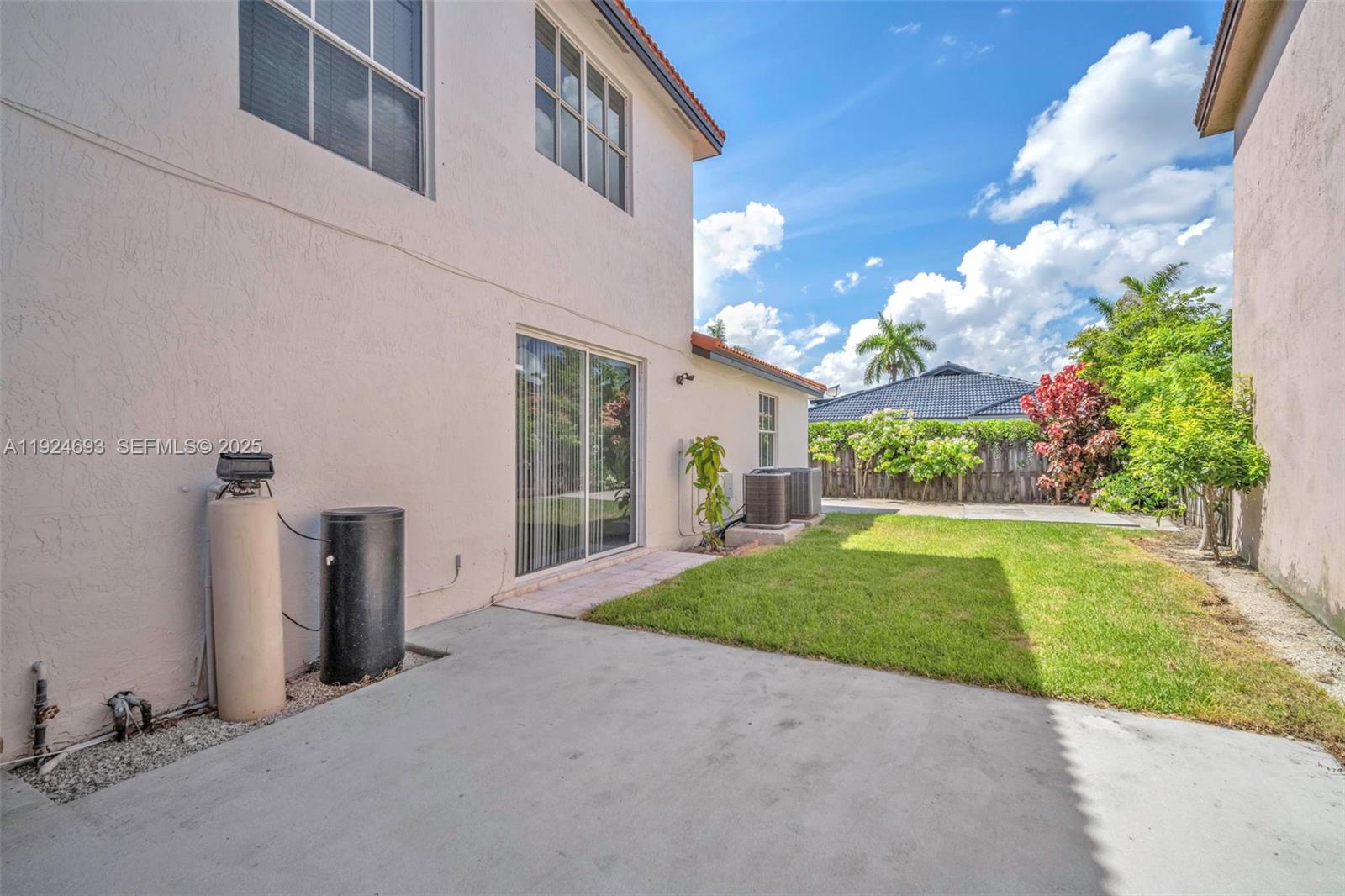 13030 Northwest 8th Street Miami, FL 33182 - Photo 9 of 54 a view of a house with a backyard