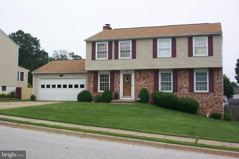 6431 St Phillips Road Linthicum Heights, MD 21090 - Photo 2 of 24 a view of a white house with a big yard and potted plants