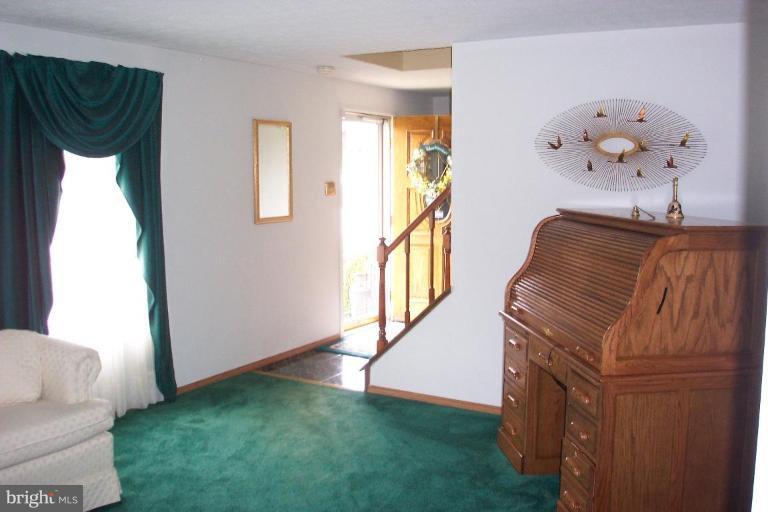 6431 St Phillips Road Linthicum Heights, MD 21090 - Photo 12 of 24 a view of entryway and hall with a wooden floor