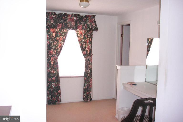 6431 St Phillips Road Linthicum Heights, MD 21090 - Photo 15 of 24 a view of a room with a and a window