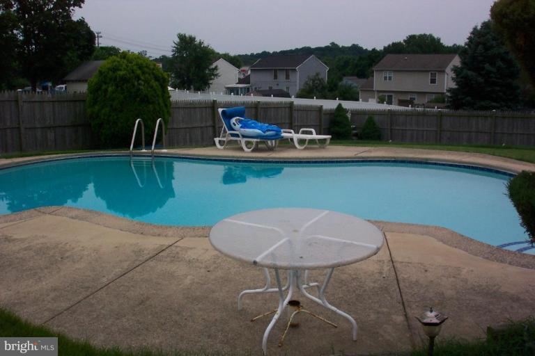 6431 St Phillips Road Linthicum Heights, MD 21090 - Photo 3 of 24 a view of a chairs and table on the terrace