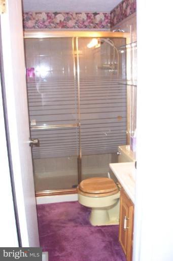 6431 St Phillips Road Linthicum Heights, MD 21090 - Photo 24 of 24 a bathroom with a sink and a mirror