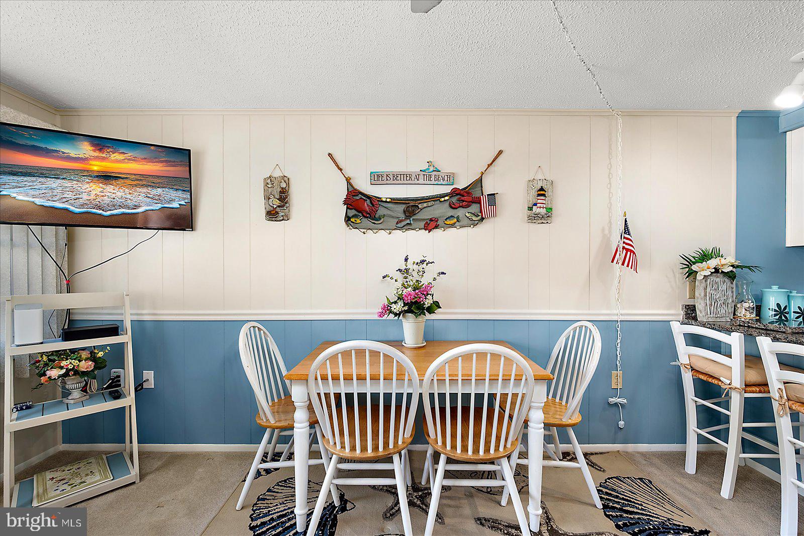 9 46th Street, Unit 22 Ocean City, MD 21842 - Photo 19 of 43 a view of a dining room with furniture window and wooden floor