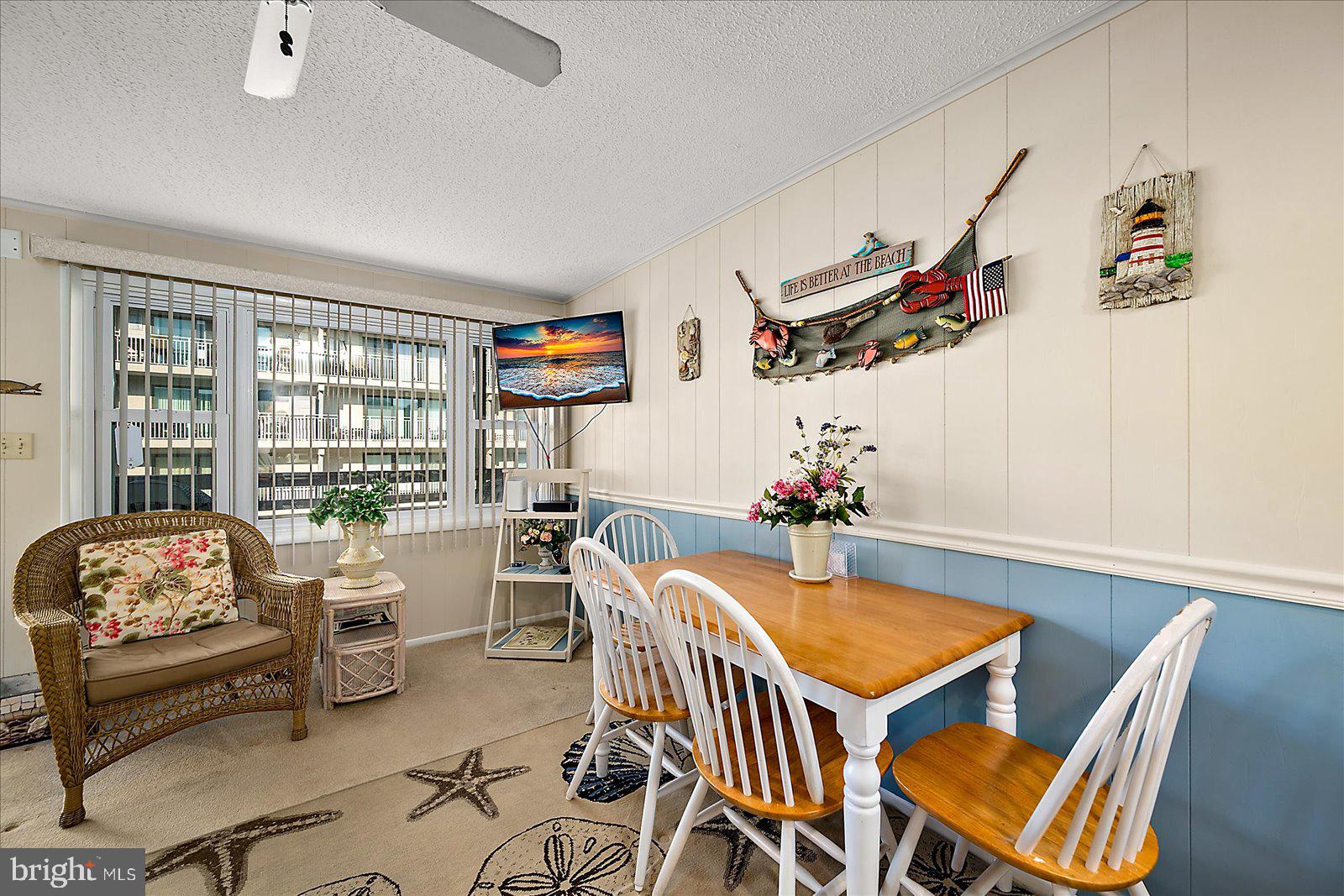 9 46th Street, Unit 22 Ocean City, MD 21842 - Photo 20 of 43 a dining room with furniture and wooden floor